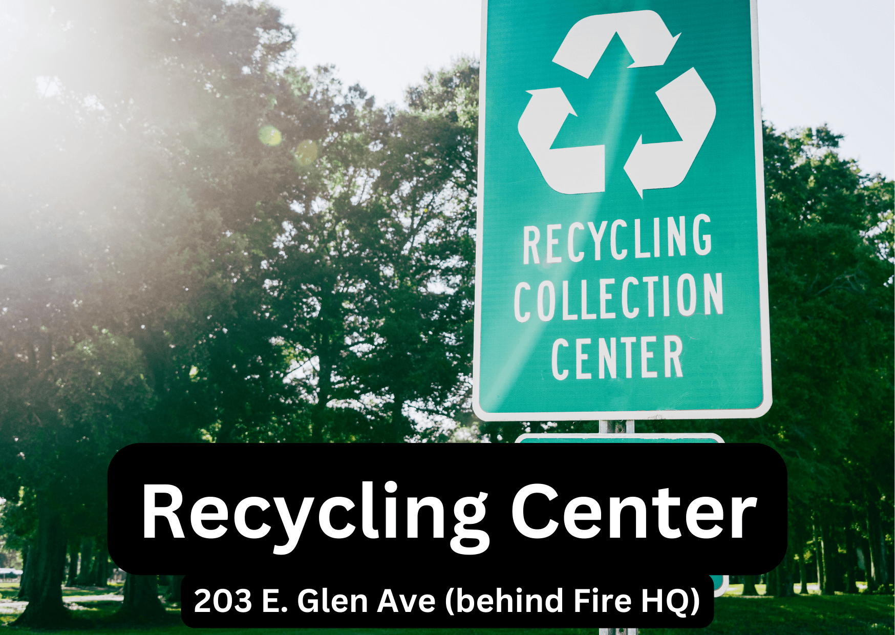 Recycling Center Sign Against Tree Background